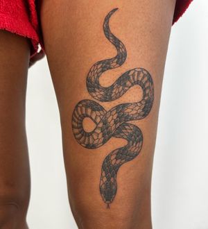 Get a stunning illustrative snake tattoo by the talented artist Paula. Embrace the beauty and symbolism of the serpent with this unique piece of body art.