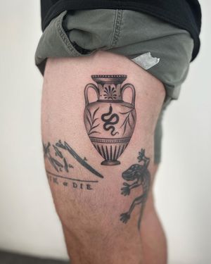 Embrace the ancient symbolism with this dotwork and illustrative tattoo featuring a slithering snake and elegant vase. Dive into the magic of Paula's artistry.