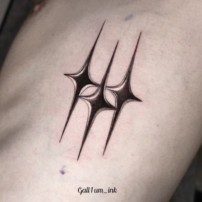Get a stunning black & gray illustrative tattoo of a chrome star by renowned artist Gloria Gu.