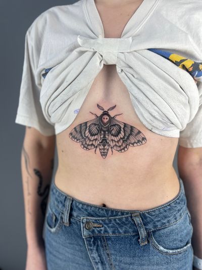 Get a stunning illustrative tattoo of a moth symbolizing death, by the talented artist Paula.
