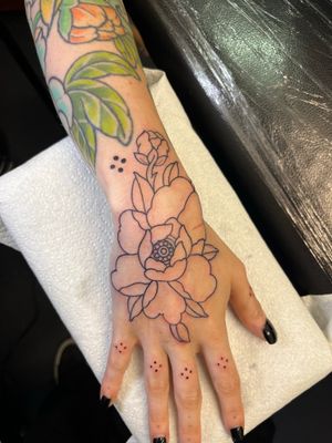 Get a stunning Japanese peony flower tattoo by Claudia Vicente, expert in intricate illustrative designs. Embrace the beauty of nature with this elegant tattoo.
