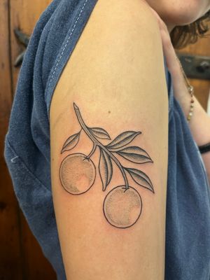 Unique dotwork tattoo by Claudia Vicente featuring an orange branch motif. Perfect for nature lovers.