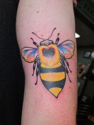 Bumble bee  with wing for pride and a semi colon 