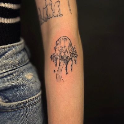 Experience the dark side of nature with this creepy and cool illustrative tattoo of a horror mushroom by the talented artist Holly Valley.