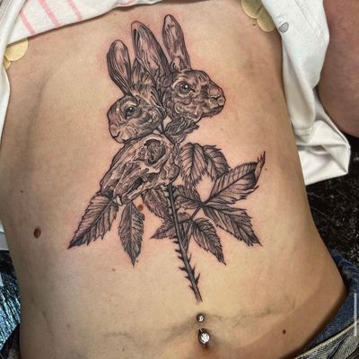 Unique tattoo design by Holly Valley featuring a rabbit, flower, skull, hare, and plant motifs. Perfect mix of beauty and darkness.
