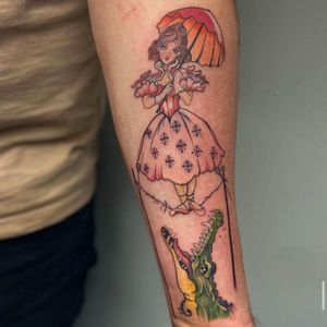Dare to walk the tightrope with this whimsical tattoo by Holly Valley. A bold and unique design featuring an alligator in a circus setting.