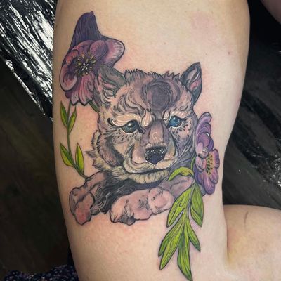 Experience the beauty of nature with this stunning neo-traditional tattoo by artist Holly Valley. The intricate design features a fox surrounded by delicate flowers, creating a captivating and timeless piece of art.