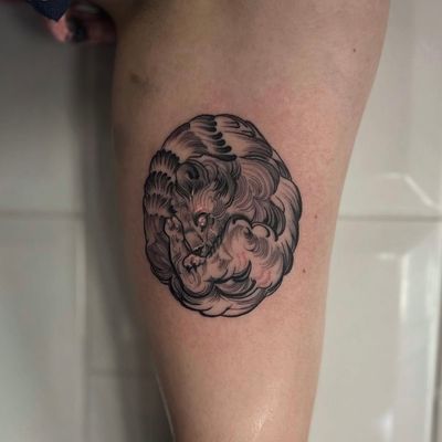 Capture the balance of strength and harmony with this detailed lion and ying yang tattoo design. Expertly crafted by artist Holly Valley.