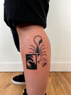Get a bold and striking blackwork scorpion tattoo with abstract design by the talented artist Dave Norman.