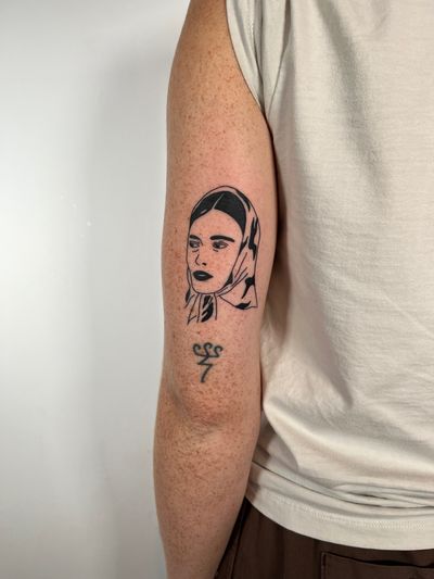 Clean and elegant illustrative tattoo of a minimalistic woman, by Dave Norman.