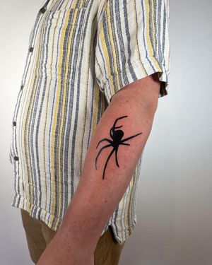 Get a bold blackwork spider tattoo by renowned artist Dave Norman for a unique and striking inked design.