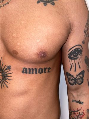 Elegant lettering and traditional style butterfly, amore, and eye tattoo designed by Louis Shadwell. A perfect blend of beauty and symbolism.
