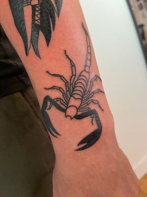 Get inked with a bold illustrative style scorpion tattoo designed by the one and only Dave Norman.