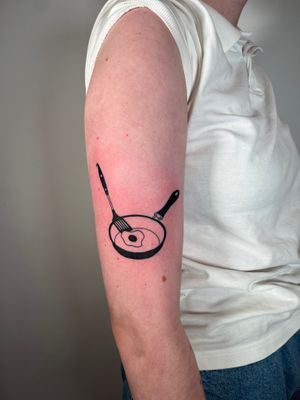 Get sizzling in the kitchen with this fun illustrative tattoo by Dave Norman. Perfect for cooking enthusiasts!