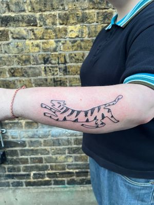 Discover the fierce beauty of an illustrative tiger tattoo by the talented artist Dave Norman.