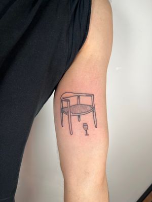 Get a bold and unique illustrative chair tattoo by renowned artist Dave Norman. Stand out from the crowd!