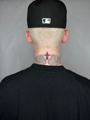 Experience the unique artistic touch of Dominga Longo with this illustrative cross tattoo. Perfect for both believers and art lovers alike.
