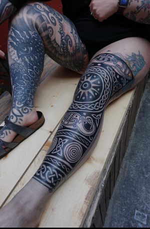 Get a stunning ornamental tribal tattoo by the talented artist Treubhan. This intricate design is sure to make a statement.