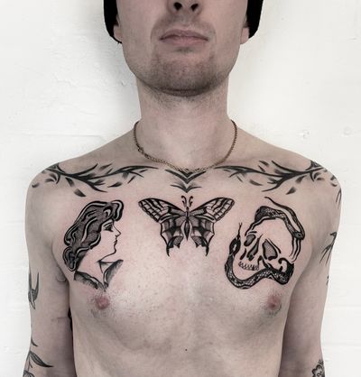 Unique dotwork design featuring a snake, butterfly, and traditional elements created by renowned artist Ludo Matmut.