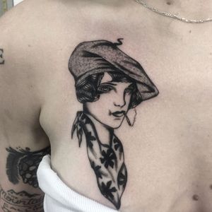 Experience the beauty of French artistry with this stunning dotwork tattoo of a woman, created by the talented artist Ludo Matmut.