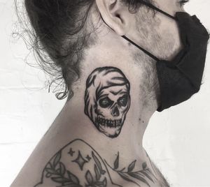 Get a stunning black and gray skull tattoo designed by the talented artist Ludo Matmut. Embrace the dark side with this unique piece!