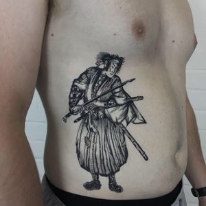 Experience a unique blend of traditional Japanese and illustrative French styles in this striking samurai tattoo by Ludo Matmut.