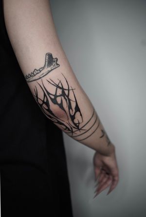 Express your connection to technology and ancient symbols with this intricate tribal design by tattoo artist Dominga Longo.
