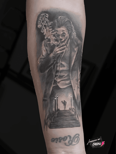 A stunning black and gray realism tattoo of the iconic Joker character from DC movies, expertly done by artist Jens Lemmens.