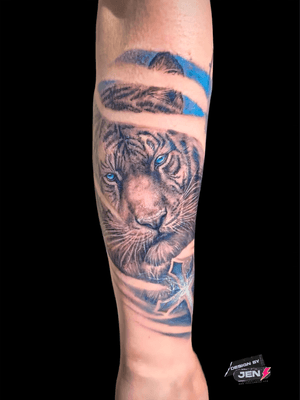 Get a fierce and stunning tiger tattoo by renowned artist Jens Lemmens. Embrace the power and beauty of nature with this striking design.
