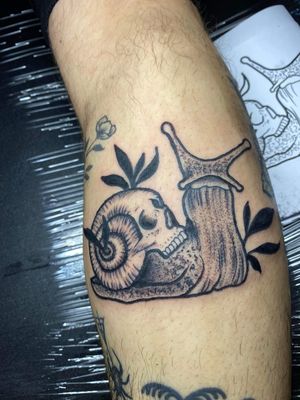 Unique dotwork style tattoo featuring a skull and snail, by artist Ben Twentyman.