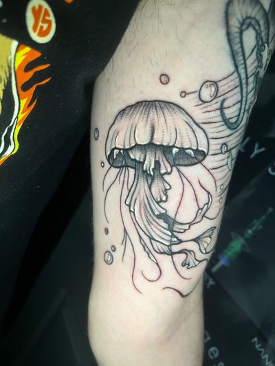 Explore the depths of art with this mesmerizing dotwork jellyfish tattoo by the talented Ben Twentyman.