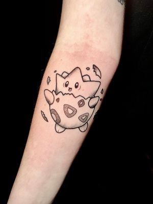 Get an illustrative dotwork Togepi tattoo in anime style by Ben Twentyman. Show off your love for Pokémon in a unique way.