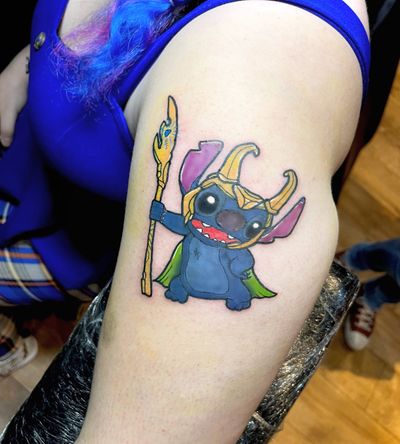 Discover the magical fusion of Stitch from Disney and Loki from Marvel in this stunning illustrative tattoo by Ben Twentyman.