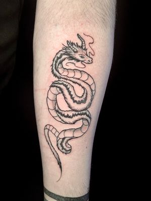 Stunning illustrative dragon tattoo by Ben Twentyman, intricately designed with dotwork and fine line techniques.