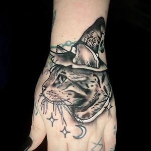 Get bewitched by this mystical black-and-gray illustrative tattoo of a wizard cat by Ben Twentyman.