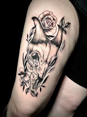 Get a stunning illustrative tattoo featuring a blend of flowers, skulls, and leaves by talented artist Ben Twentyman.