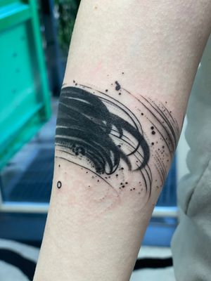 Unique illustrative tattoo by Hannah Keuls featuring a brush sketch motif with vibrant watercolor accents.
