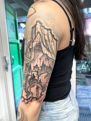 Capture the serenity of the mountains and the beauty of the forest with this black and gray illustrative tattoo by Hannah Keuls.