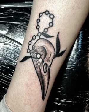 Express your edgy side with this unique tattoo featuring a bird, skull, and beads in a stunning illustrative style by the talented artist Ben Twentyman.