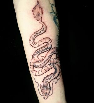 Get a stunning fine line and illustrative dragon tattoo by the talented artist Ben Twentyman.