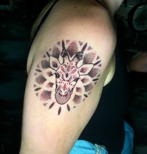 Discover the intricate beauty of dotwork with this stunning giraffe mandala tattoo by the talented artist Ben Twentyman.