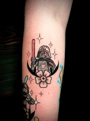 Illustrative tattoo by Ben Twentyman combining a flower, Lego, and Darth Vader from Star Wars in stunning dotwork style.
