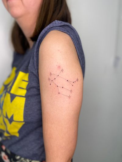 Experience the beauty of stars and constellations with this dainty ornamental dotwork tattoo by Viví Bogdanov.