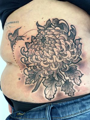 Elegant black and gray illustrative flower tattoo by Hannah Keuls. A stunning and timeless piece of art.