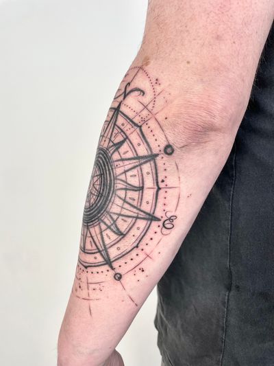 Get inked with a unique geometric and illustrative tattoo featuring a compass and chart, crafted by the talented artist Hannah Keuls.