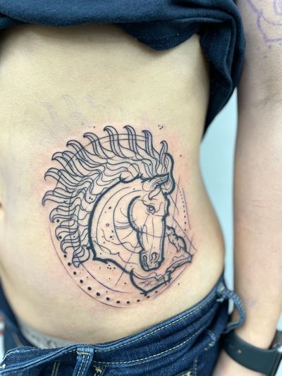 Discover this unique tattoo by Hannah Keuls featuring a geometric and illustrative style with a sketch motif of a horse.