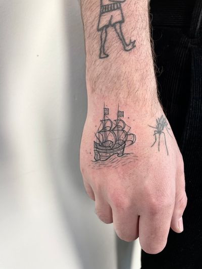 Get a unique illustrative tattoo of a ship done by artist Hannah Keuls. Perfect for those who love nautical themes.