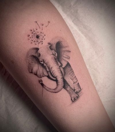 Unique black and gray dotwork design by Nat, combining the strength of an elephant with the fragility of a dandelion.