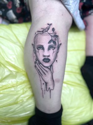 Explore the ethereal beauty of this dotwork and fine line tattoo featuring a woman wearing a mysterious mask, expertly crafted by Nat.