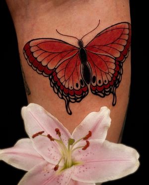 Capture the beauty of nature with this vibrant butterfly tattoo by Edyta. Neo-traditional style adds a modern twist to a classic motif.